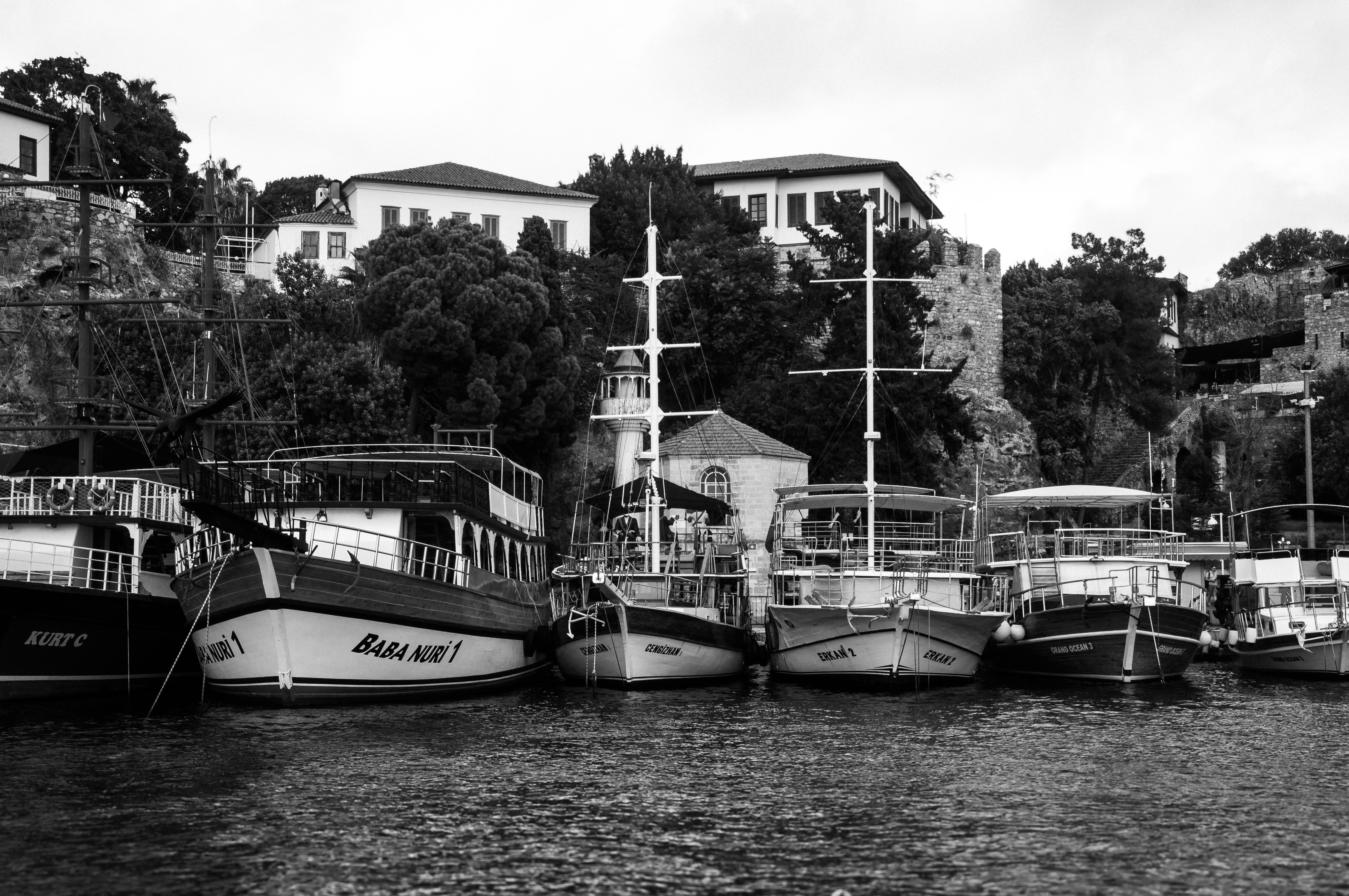 Historic Boats Docked on a Serene Harbor · Free Stock Photo