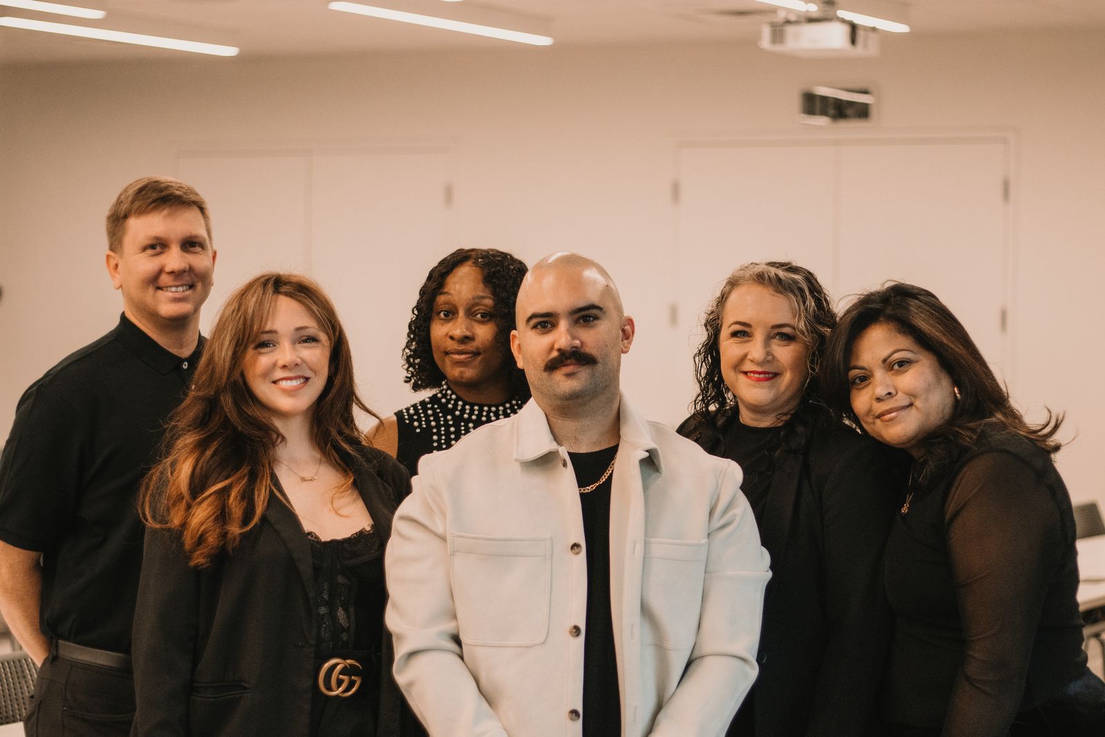 A diverse team of advisors in a professional office setting.