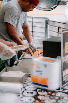 A street vendor prepares churros at a local market in Santiago, Nuevo Leon, Mexico.