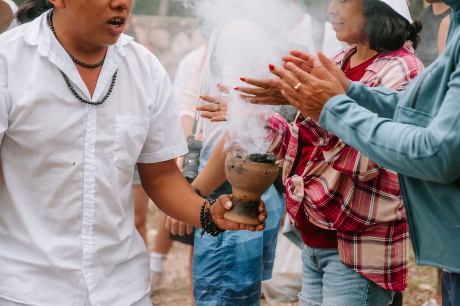 Ceremonial ritual with smoke — plant medicine ceremony requires rigorous safety standards