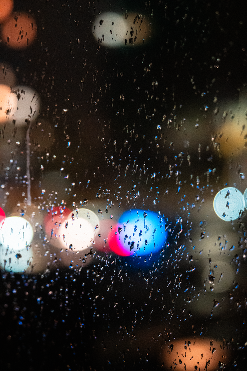 Rainy Window with City Street Lights Bokeh · Free Stock Photo