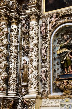 Detailed view of Baroque architecture with ornate carvings and sculptures in Apulia, Italy.