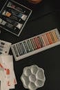 Artist's tools with vibrant pastels and paints