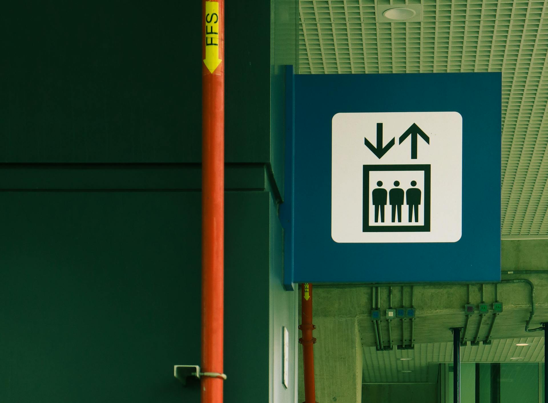 Elevator direction sign in a building in Ho Chi Minh City, Vietnam.