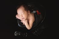 Adorable Sleeping Baby in Helmet