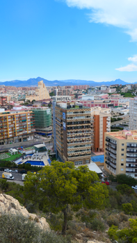 Scenic view of Alicante's urban landscape highlighting distinctive architecture on a sunny day.