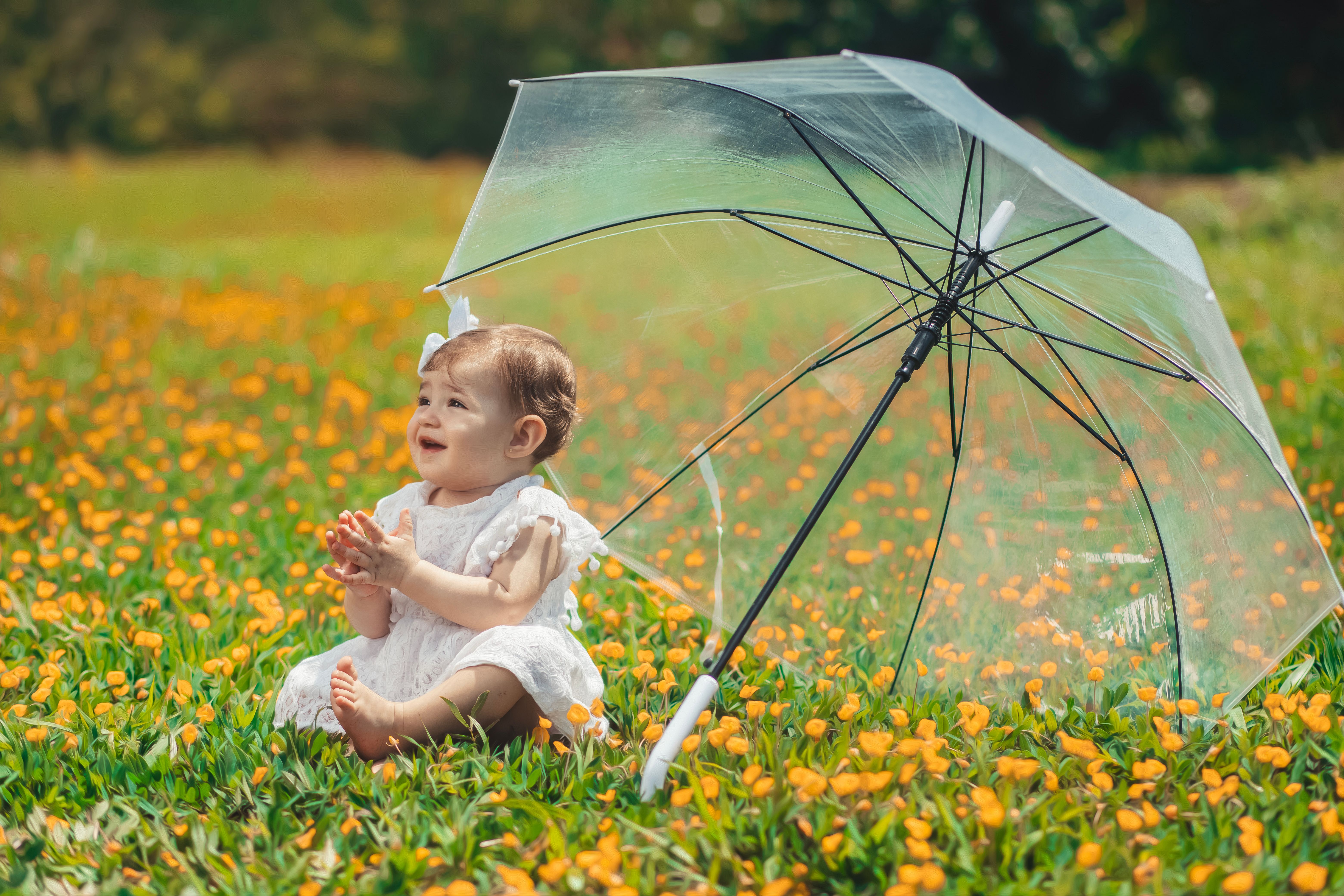 Adorable Baby Plays in Flower-Filled Meadow · Free Stock Photo