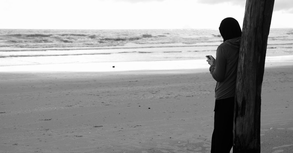 Someone Relenting Person Reflecting by the Beach in Black and White · Free Stock Photo