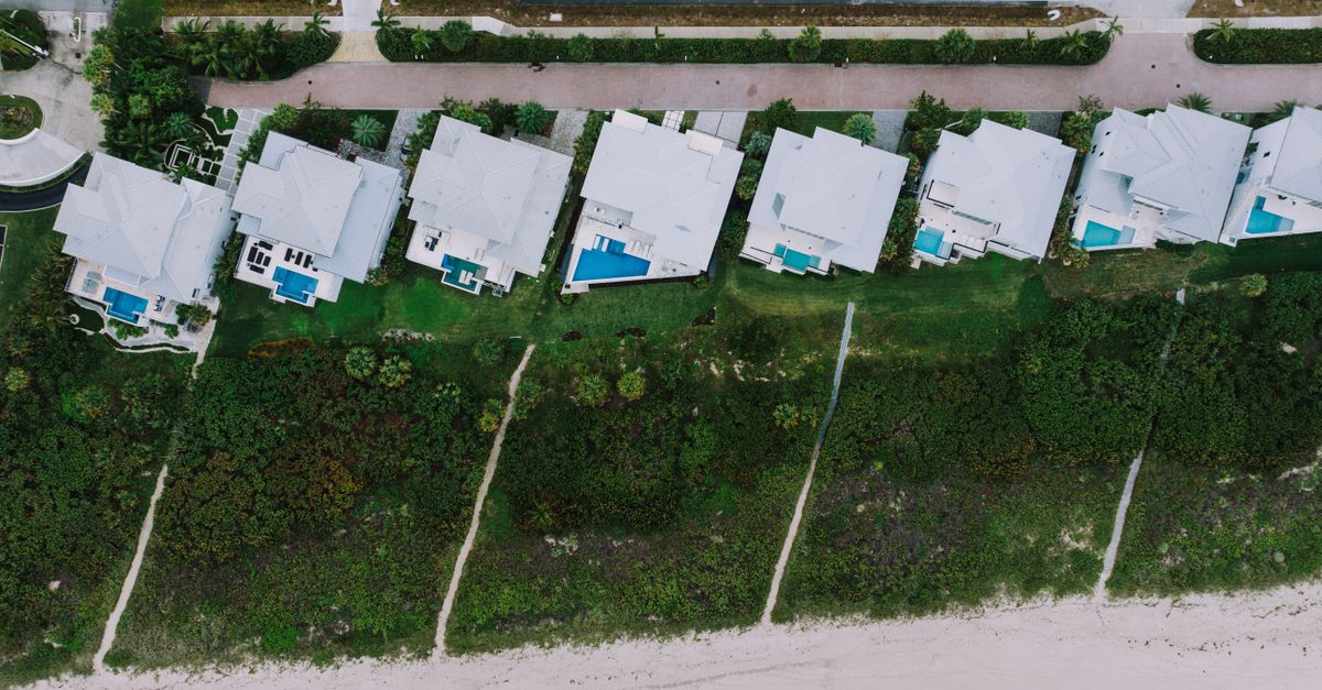 Stunning aerial view of beachfront homes with pools in Fort Pierce, Florida.