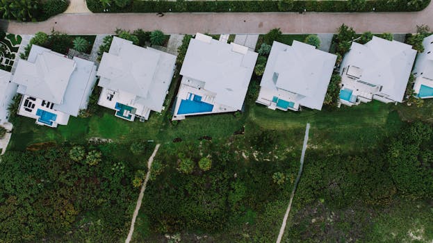 Aerial shot showcasing modern homes with pools in Fort Pierce, Florida neighborhood.