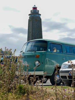 Classic van parked near the Fermanville lighthouse in Normandy, France.