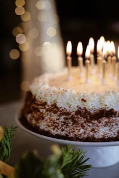 Close-up of a birthday cake with lit candles, perfect for celebrations.