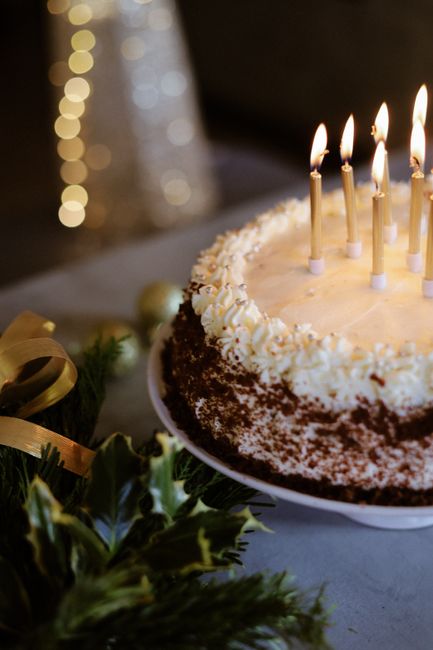 Close-up of a festive cake with candles lit, perfect for celebrations.