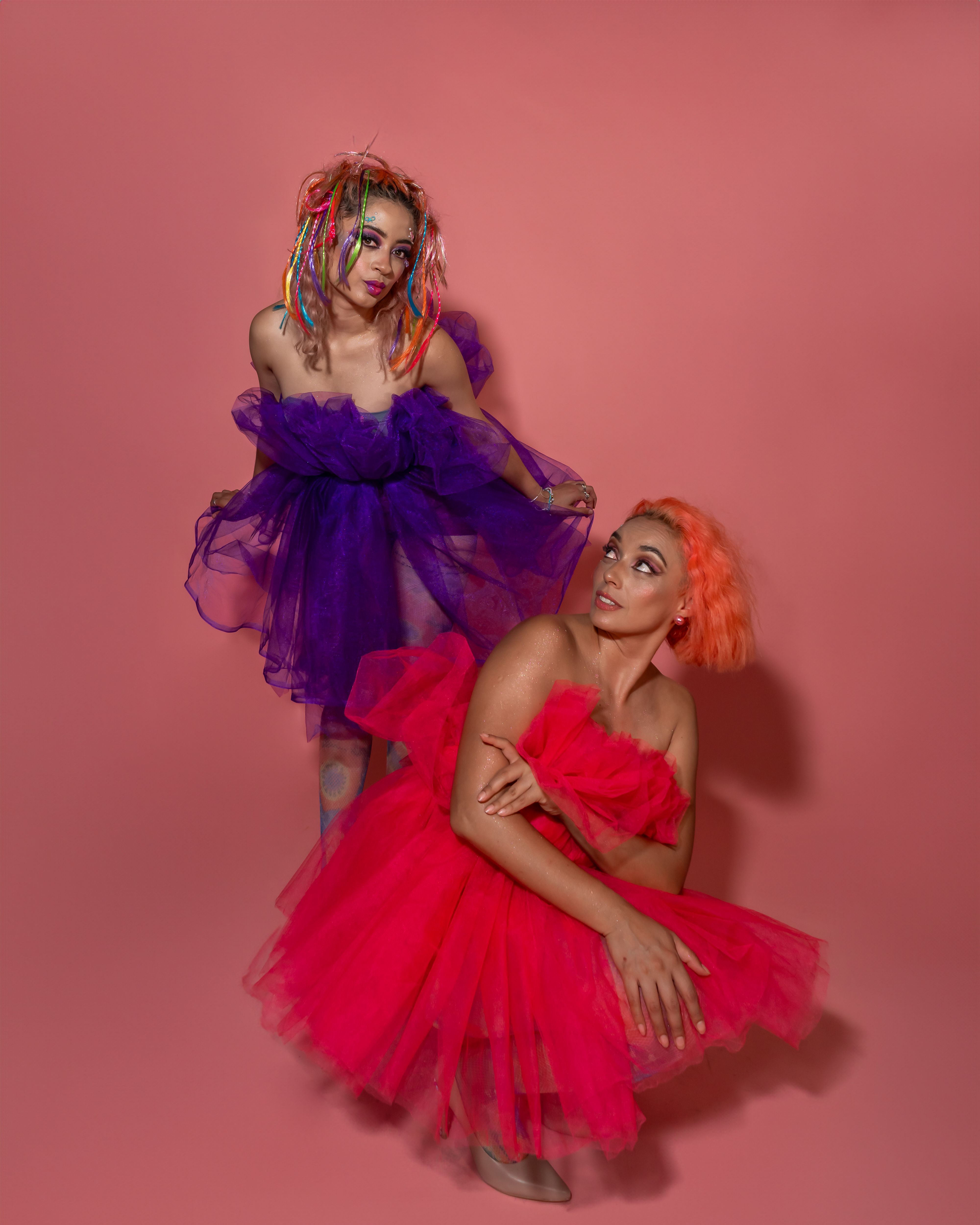Vibrant Portrait of Women in Colorful Dresses · Free Stock Photo