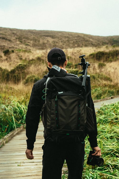 Man Carrying Black Backpack