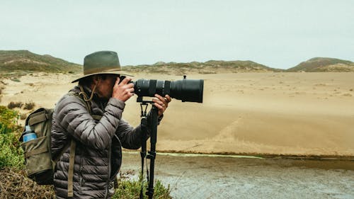 Free Man Holding Camera Stock Photo