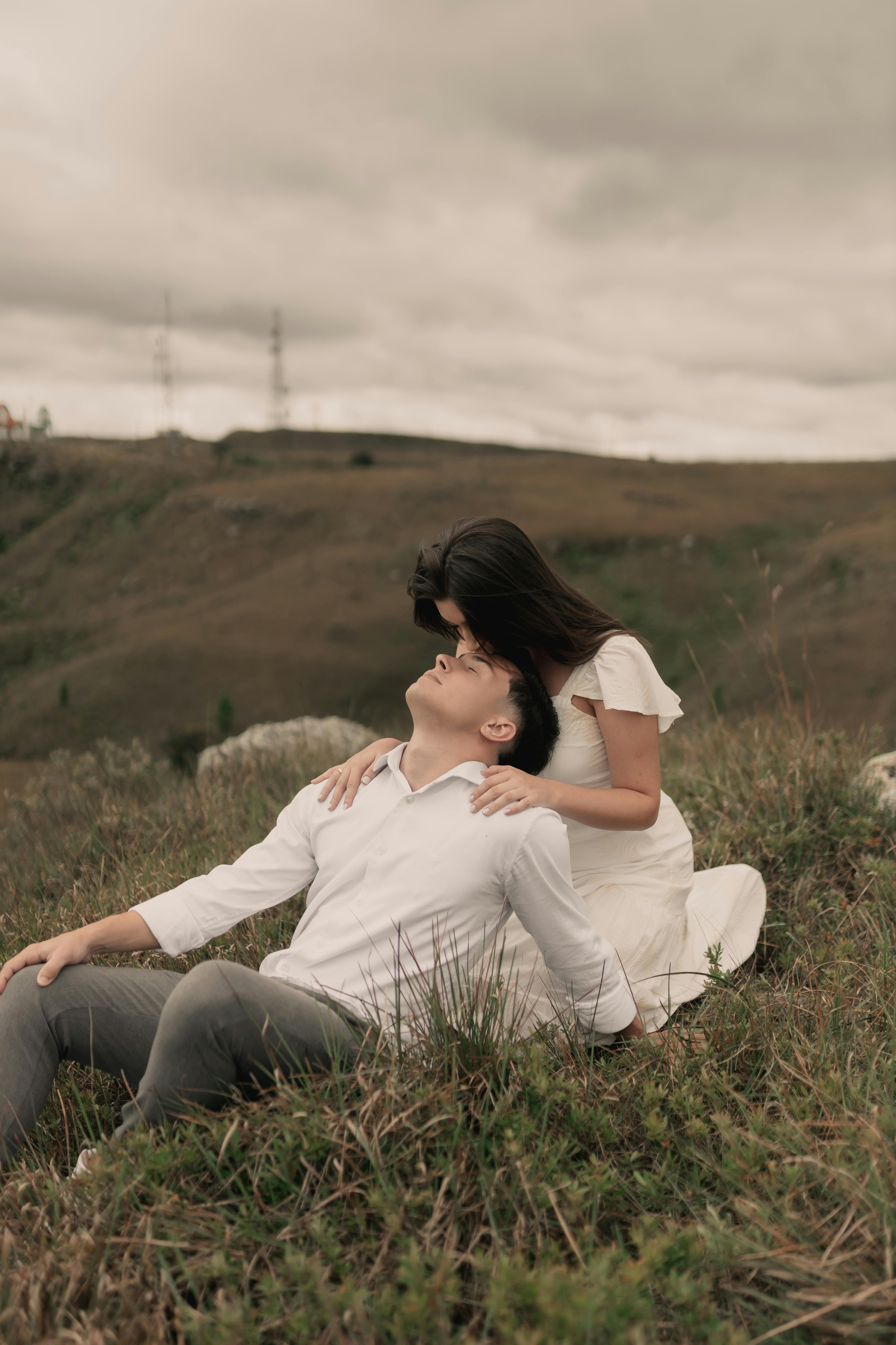 romantic couple embracing in scenic landscape