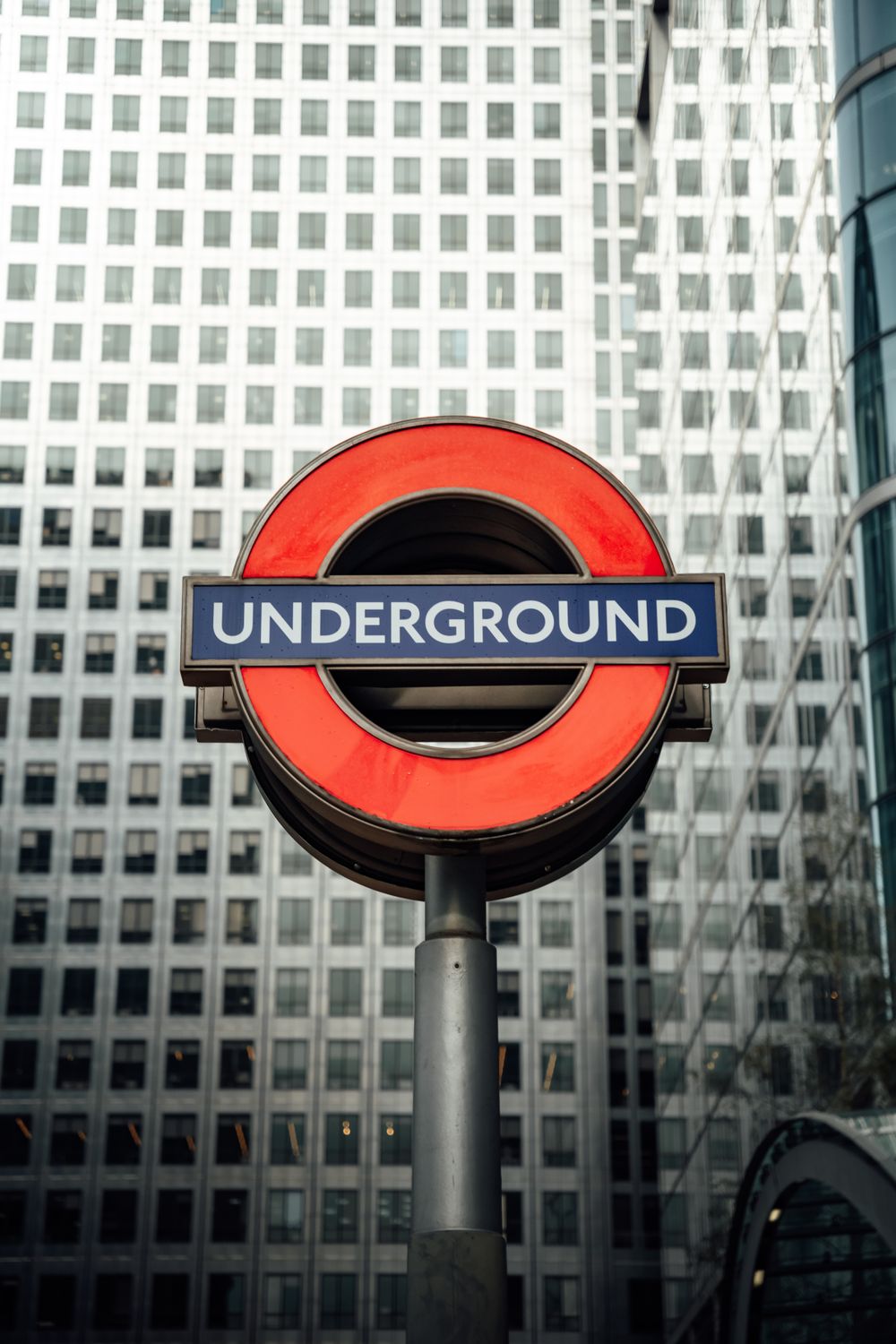 Iconic London Underground Sign at Canary Wharf · Free Stock Photo