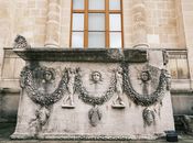 Intricately carved Roman sarcophagus with reliefs, showcasing ancient art and architecture.