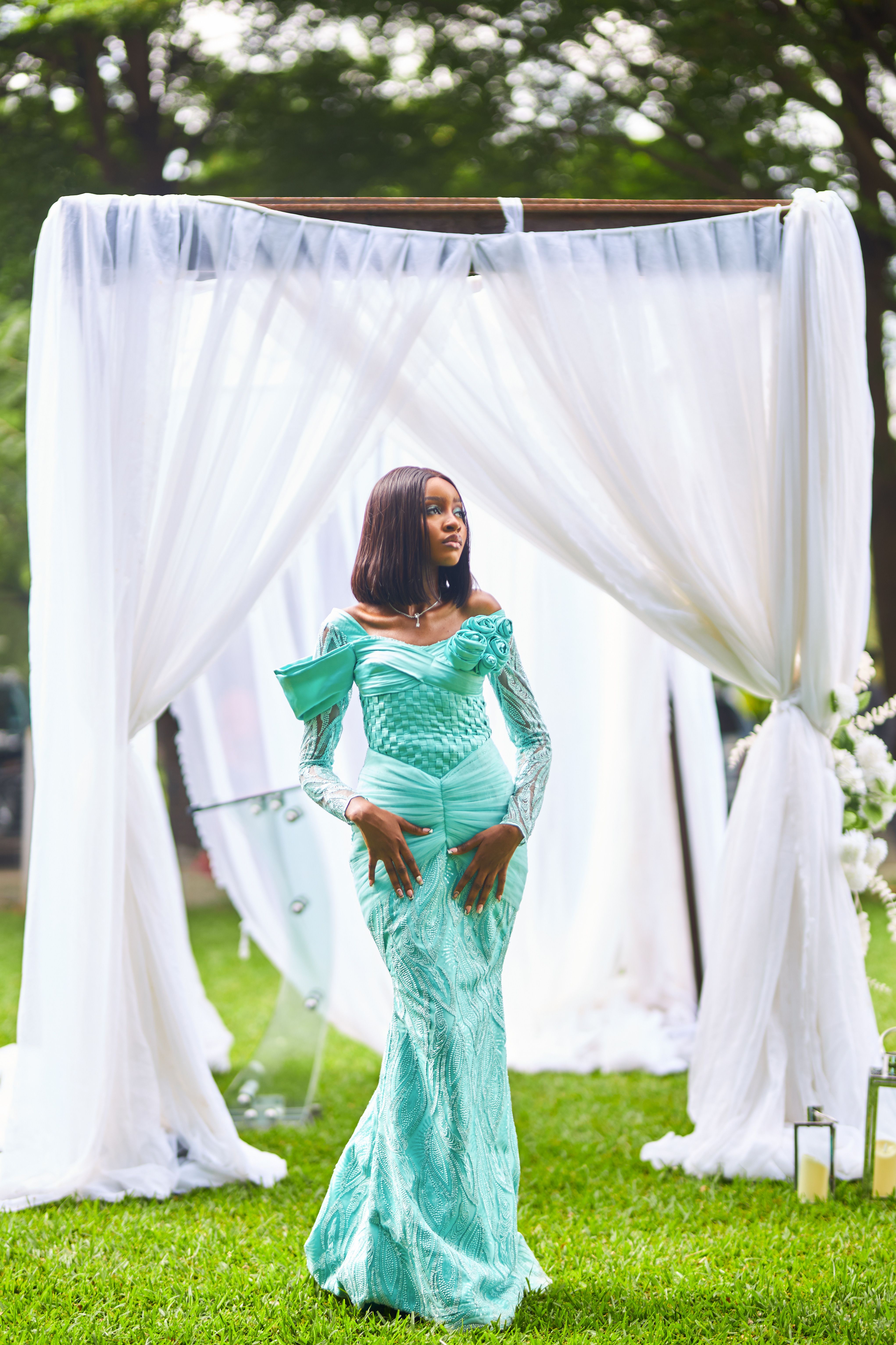 Elegant Woman in Mint Green Dress at Outdoor Ceremony  Free Stock Photo