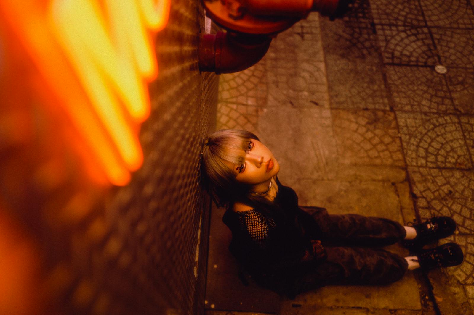 Night portrait with neon glow showing warm palette and subtle vignette
