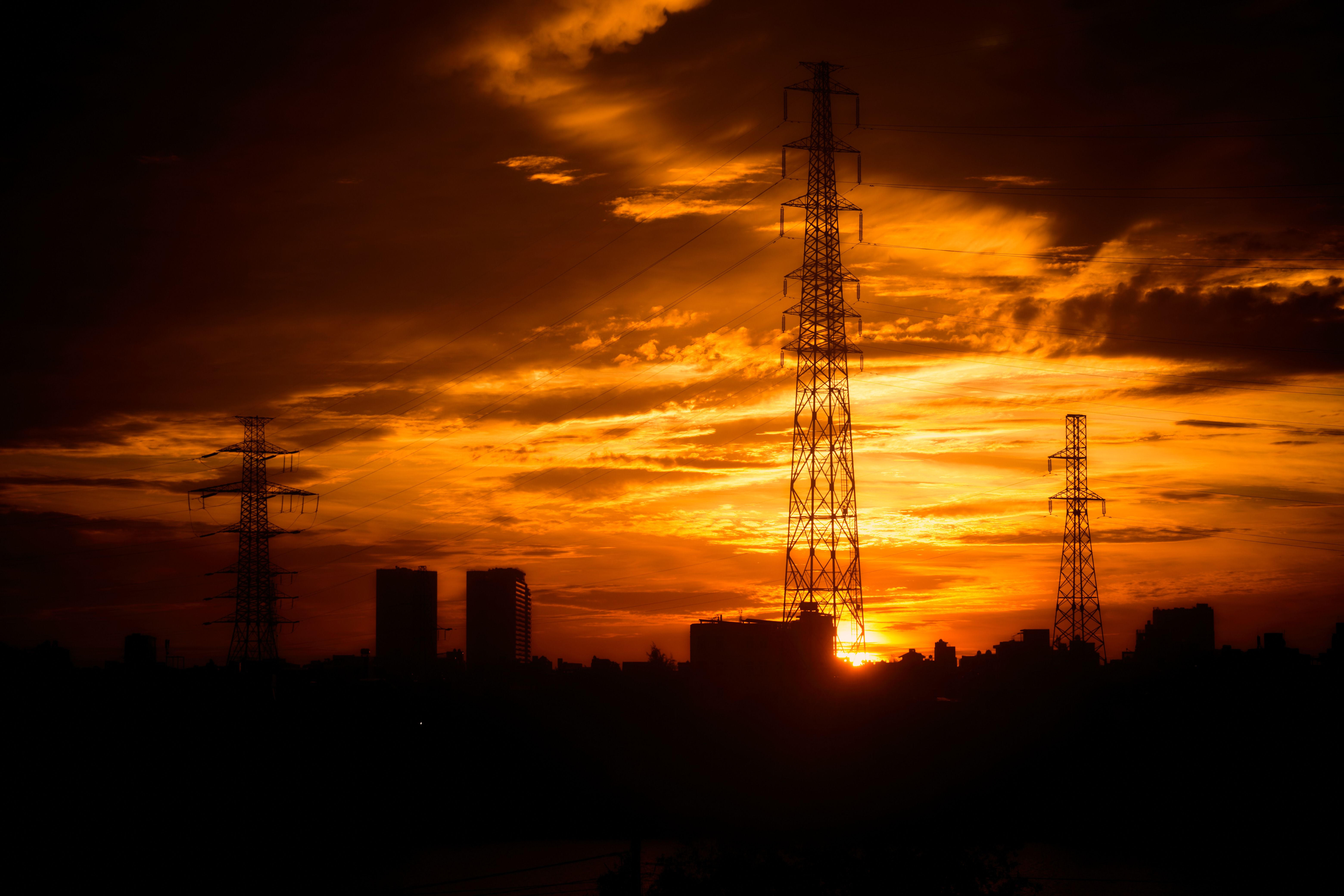 Silhouette of City Skyline at Vibrant Sunset · Free Stock Photo