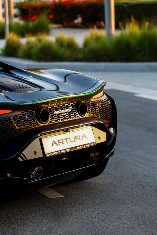 Luxury Sports Car Rear View at Sunset · Free Stock Photo