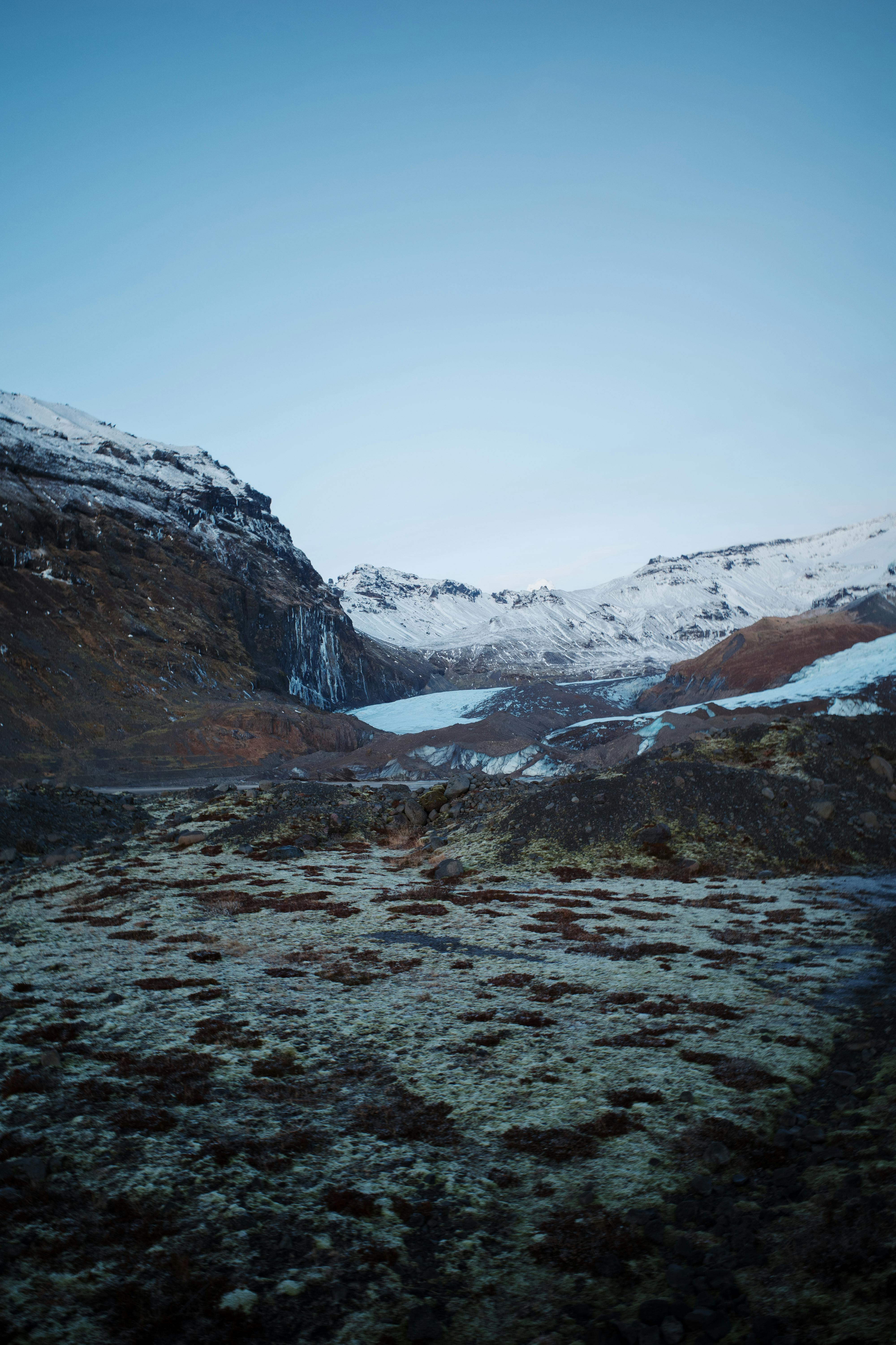 A breathtaking view of a remote snow-capped mountain range during winter.