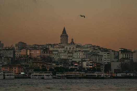 Serene view of Istanbul's skyline with the iconic Galata Tower at dusk.