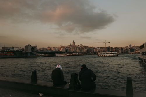 Free Serene evening view of Istanbul's Bosphorus, featuring Galata Tower and tranquil waters. Stock Photo