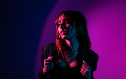 Portrait of a woman in vivid neon lighting, photo by Eduardo HernandezSoto on Pexels