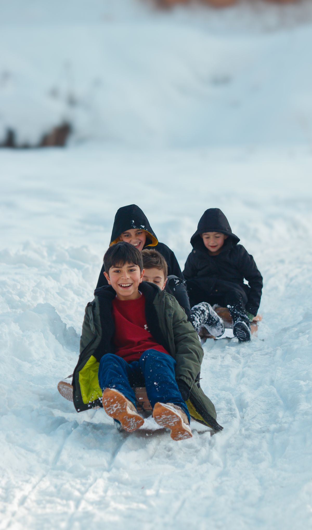 Kids on sled in snow