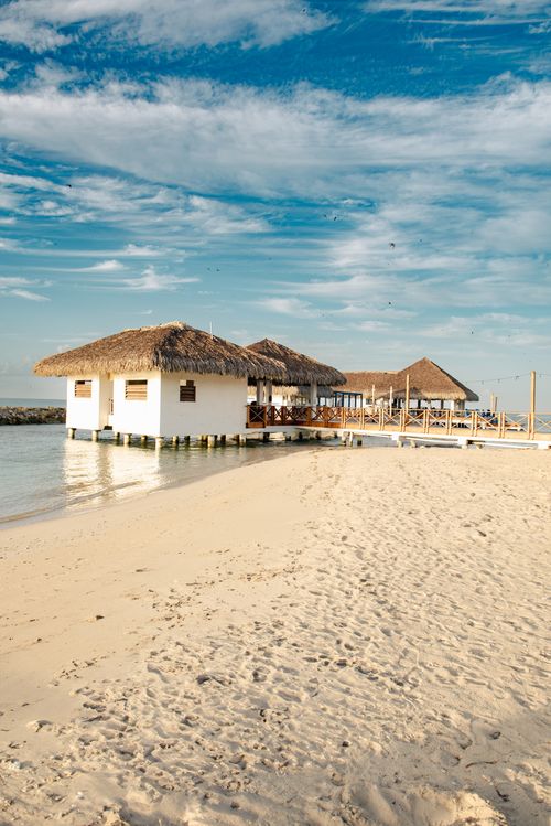 Free Idyllic view of seaside huts on a sandy beach in the Dominican Republic. Stock Photo