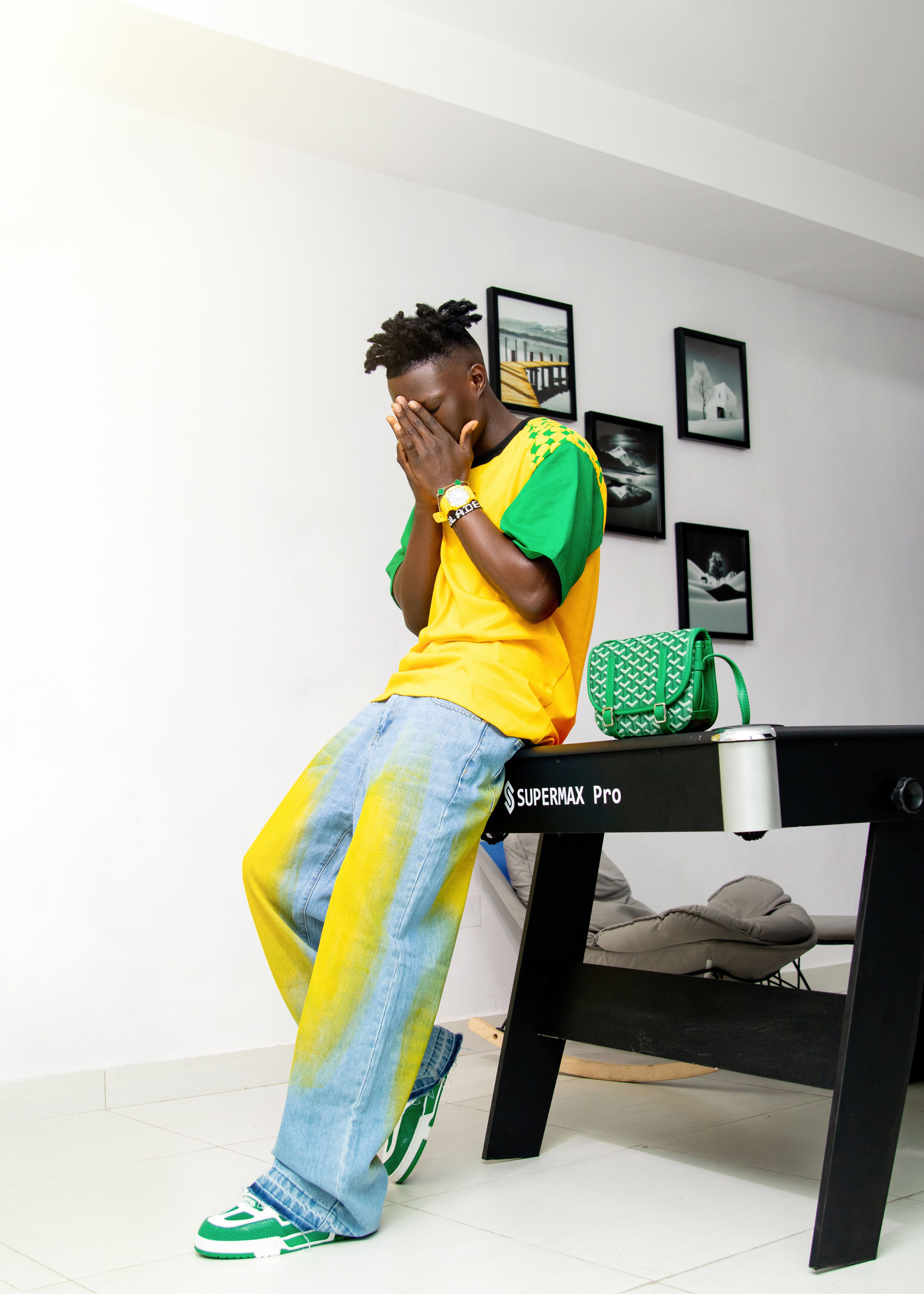 Young adult in colorful attire with trendy accessories indoors