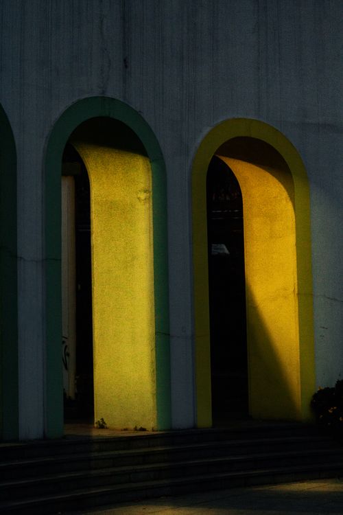 Free Atmospheric evening sunlight casting warm hues through colorful arches in İstanbul. Stock Photo