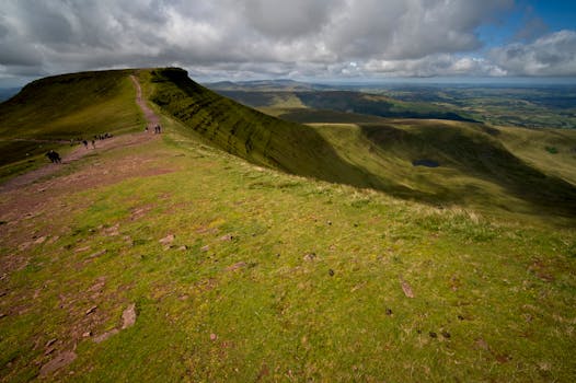 Explore the stunning rolling hills of Brecon Beacons, Wales, perfect for hiking and nature lovers.