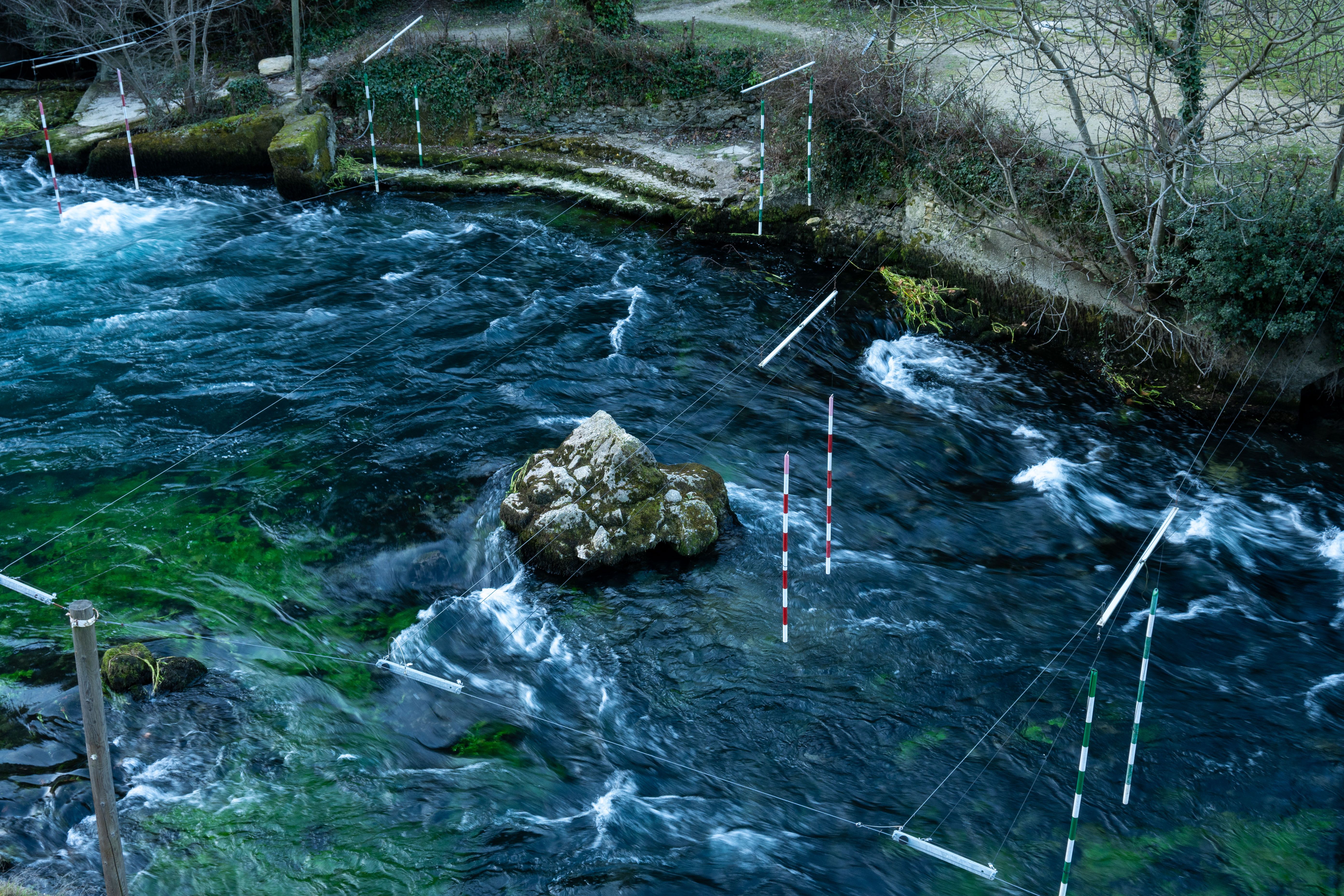 Aerial view of a kayak course on a swirling river in Provence, France.