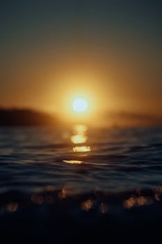 Mesmerizing ocean sunset with vivid colors reflecting on the water surface.