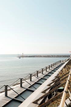 Captivating view of a coastal structure with clear skies and tranquil sea.