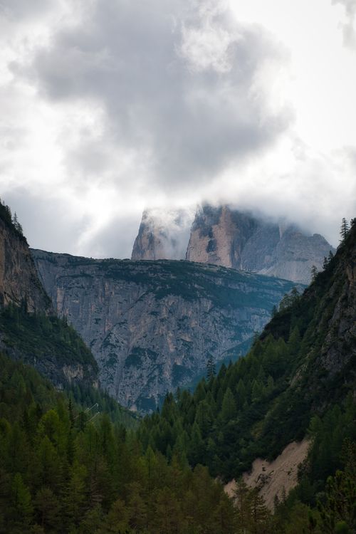 Free Stunning landscape of the Dolomites in Trentino-Südtirol, enveloped by clouds. Stock Photo