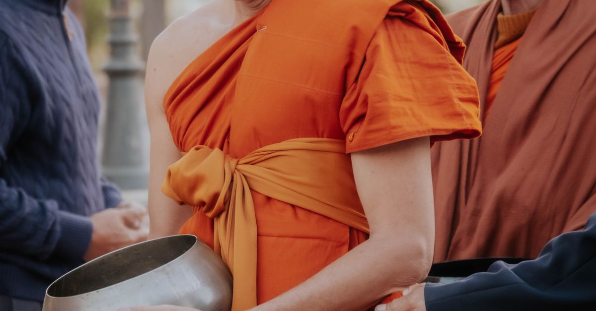 Buddhist Monks in Traditional Robes Offering Alms · Free Stock Photo