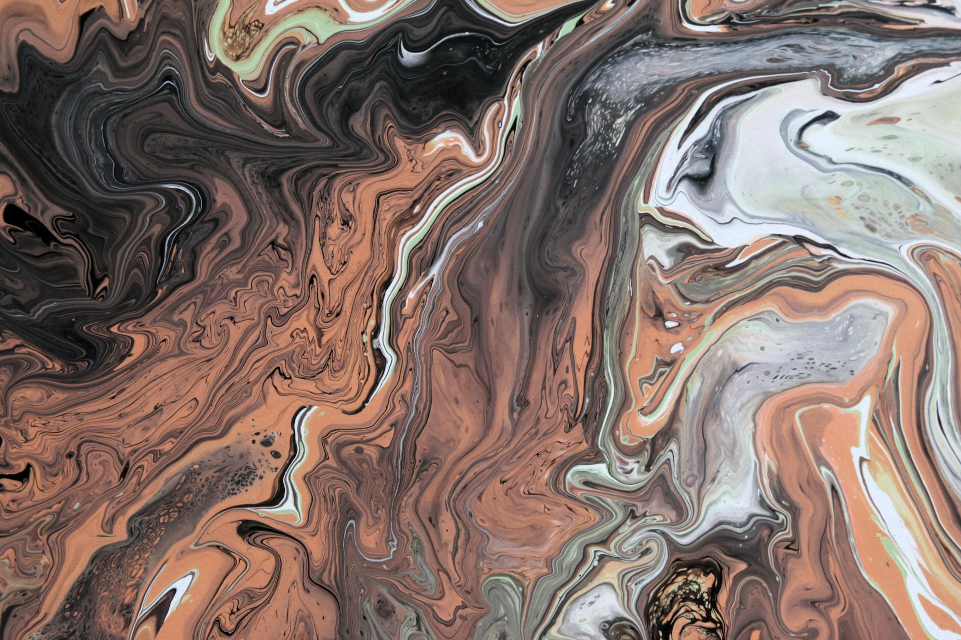 Colorful abstract acrylic paint swirl with earthy tones. Perfect for modern art enthusiasts.