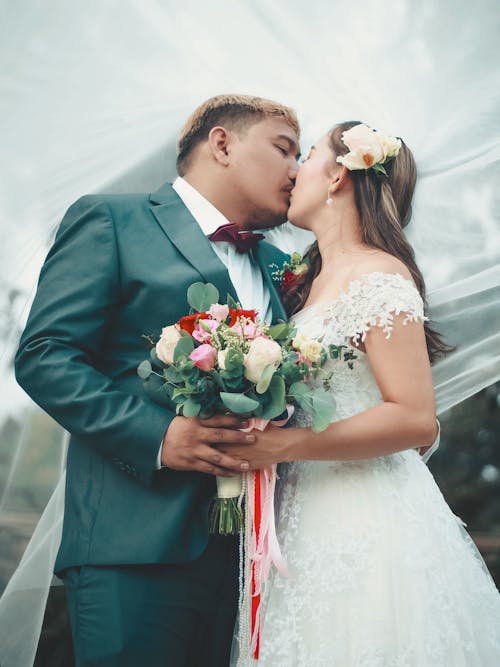 A Newlywed Couple Kissing