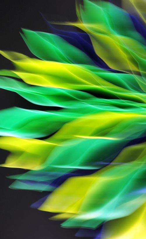 Free Dynamic abstract art featuring vivid green and yellow hues with motion blur effect. Stock Photo