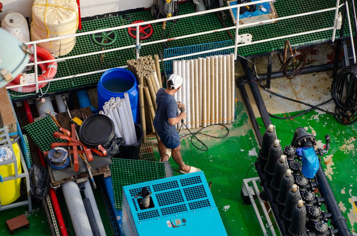 Working vessel deck with marine equipment