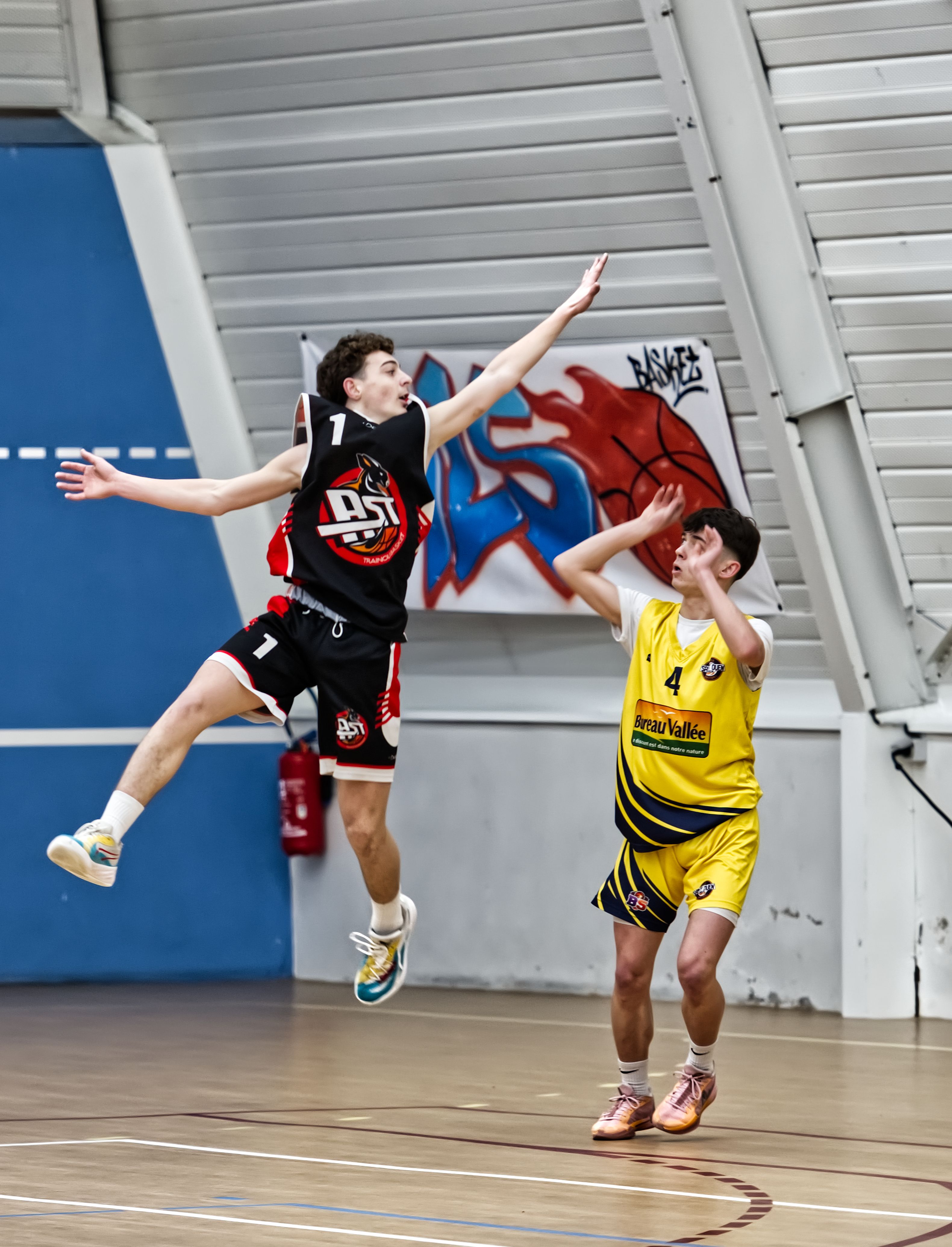 Representative photograph of players in an indoor basketball game; not the Nuggets–Pelicans matchup or NBA players