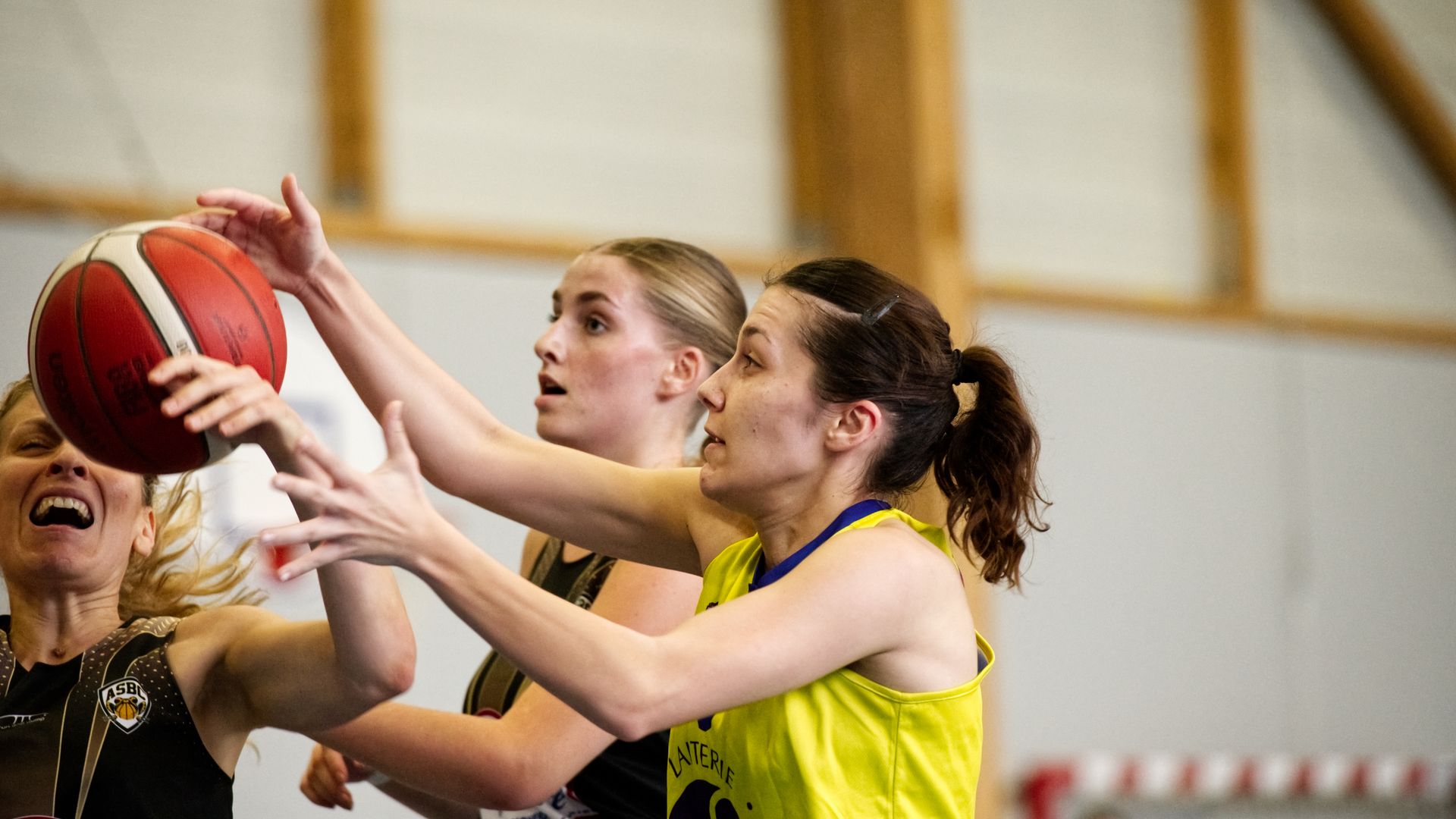 Women's college basketball game in action