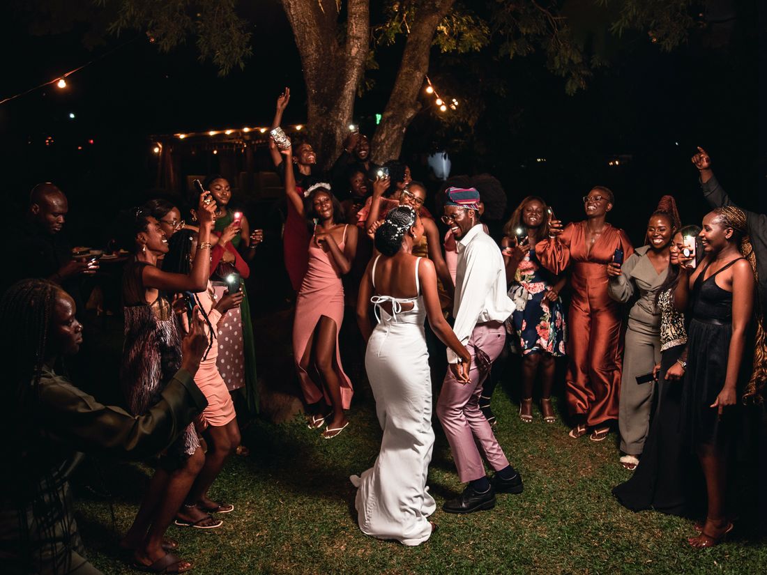 Guests celebrating joyfully on the dance floor at a wedding