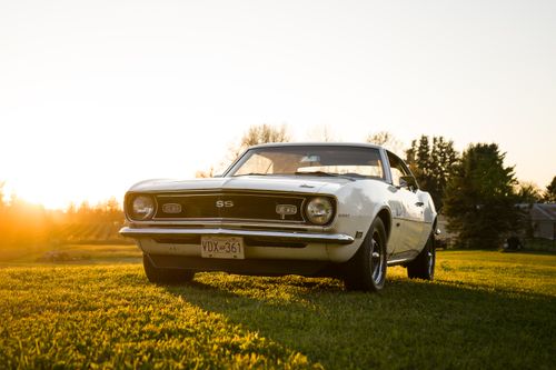 Free Vintage 1968 Camaro parked in open field during a warm autumn sunset in Vancouver, BC. Stock Photo