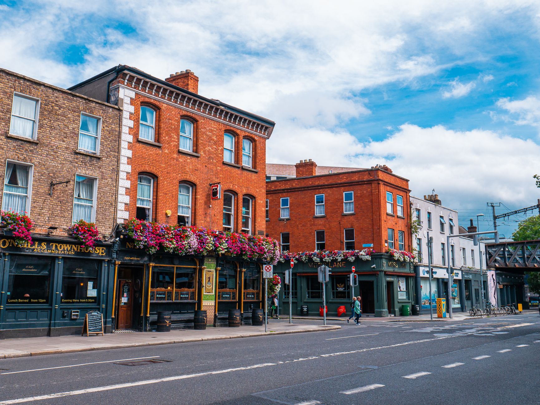 Vibrant scene of historic buildings and street life in Dublin, Ireland.